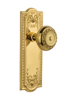 an ornate brass door handle on a white background