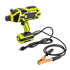 a corded electric drill is plugged into a charger