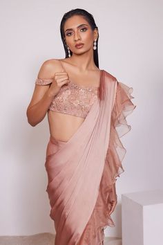 Light copper pre- draped ruffle skirt saree with embroidered waist band. Paired with an embroidered padded blouse. - Aza Fashions Fitted Organza Pre-draped Saree With Ruffles, Pink Georgette Blouse Piece With Ruffles, Saree-shape Ruffled Blouse For Party, Fitted Ruffled Saree, Wedding Blouse Piece With Ruffles, Draped Blouse With Ruffles, Fitted Blouse With Ruffles And Traditional Drape, Fitted Ruffled Blouse With Traditional Drape, Elegant Pink Ruffled Blouse Piece