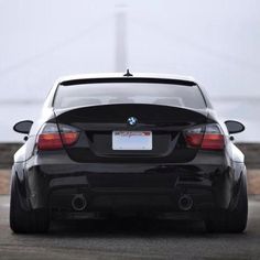 the back end of a black bmw car