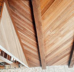 the inside of a wooden building with wood slats on the walls and flooring