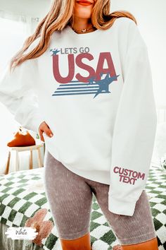 USA Tshirt, Lets Go USA Shirt, Summer Games Shirt, Comfort Colors Shirt, America Shirt, Comfort Colors Patriotic Shirts For Women, USA Shirt Custom text on sleeve.  Custom made just for you! 💜Premium Comfort Colors Lightweight Sweatshirt💜 This is the perfect lightweight crewneck 4th of July!  Trendy comfort colors sweatshirt with retro usa design. Cute shirt for her for cool summer nights around the bonfire. Gift for her for the summer games. Has vintage USA with stars in a retro design. Cute Relaxed Fit Crew Top With Custom Print, Gymnastics Sweatshirts, Go Usa, Usa Sweatshirt, Usa Design, Comfort Colors Sweatshirt, Summer Games, Usa Shirt, Comfort Colors Shirt