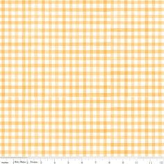 a yellow and white checkered fabric with a ruler in front of the bottom half