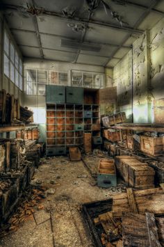 an old room with lots of wooden boxes