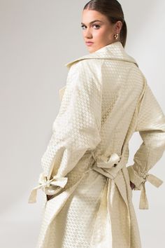 The Mae Trench Coat is a reinvented bold twist on the classic Mary Trench Coat. Crafted from pure jacquard silk, it is a double-breasted coat that comes in a relaxed fit with wide lapels, collar, and sleeves. It's elevated through its minimal interwoven matte-finished chequered pattern, fluid shape, and French seams. This sustainable trench coat is tailor made and on demand and takes us 10 hours to make it. PLEASE ALLOW 1-5 BUSINESS DAYS FOR PRODUCTION Luxury Silk Double-breasted Outerwear, Chic Silk Outerwear With Hidden Button Closure, Luxury Silk Outerwear For Spring, Chic Silk Double-breasted Outerwear, Spring Formal Jacquard Outerwear, Formal Spring Jacquard Outerwear, Cream Silk Outerwear For Fall, Chic Silk Outerwear For Daywear, Chic Fall Jacquard Outerwear