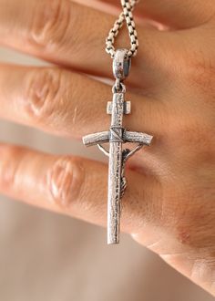 This beautiful Catholic silver cross is the perfect representation of your faith. Perfectly crafted, it is a must-have for all Catholics. Let it serve as a reminder of your beliefs. Sterling silverPendant: 61 x 23 mmBail size: 7.5 x 5.5 mmPlease note: pendant only; chain sold separatelyShown with: ROUND BOX SILVER CHAIN (2.6 MM) Processing time 1-3 business days White Gold Polished Cross Necklace, Silver Crucifix Necklace With Polished Finish, Spiritual White Gold Cross Pendant Necklace, White Gold Sterling Silver Cross Necklace, Symbolic Crucifix Cross Necklace As Gift, Spiritual White Gold Crucifix Cross Necklace, White Gold Crucifix Necklace Spiritual Style, Spiritual White Gold Crucifix Necklace, Engraved White Gold Cross Necklace