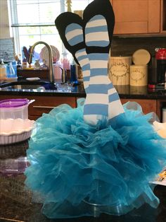 a blue and white dress sitting on top of a counter