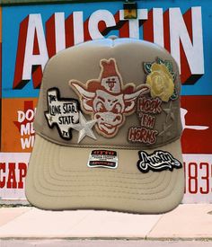 The Perfect Hat does exist! This is the AUSTIN multi-patch trucker hat. Available in tan (as seen in the images), solid black, solid brown, solid gray, solid charcoal and solid white. We do not make them until they are ordered so please allow 1-3 days for production. Patches are available separately. All patches ship with commercial grade heat transfer adhesive on the back so you can iron it on your favorite hat, jacket, shirt etc... Thanks for visiting our listing! Hook 'Em Texas Trucker Hat, Iron On Patch Trucker Hat, Trucker Hat Patch Ideas, Patch Hat Ideas, Trucker Hat Patches, Trucker Hats With Patches, Trucker Hat Ideas, Ut Texas, Preppy Orange