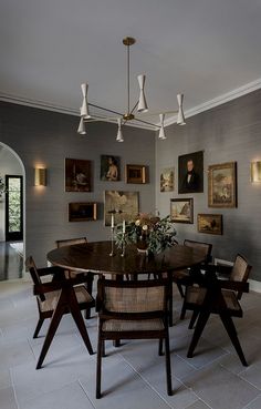 a dining room with pictures on the wall and an instagramr to share it