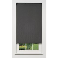 a black roller blind in front of a window