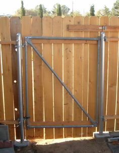 a wooden fence with metal bars on it