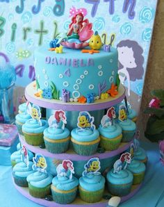 a little mermaid birthday cake and cupcakes