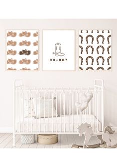 a baby's room with two pictures on the wall and a crib next to it