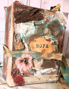 an altered book with the word hope written on it