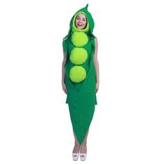 a woman wearing a green pea costume with four peas on it's back, standing in front of a white background