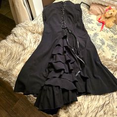 This Is A Beautiful, Double Layered, Black Satin Lined, Ribboned And Ruffled Victorian Period Skirt. It Has A Satin Ribbon Lacing From Top To Ruffle. This Is A Real Piece Of Clothing, Not Costume Grade. I Did ,However, Wear It For A Penny Dreadful Halloween Costume. The Size Says 46...I Was A Size 12 At The Time But It Fits High Up...Not At The Waist And Could Go Larger. It's Length Is 40 1/2 Inches From Top To Bottom, And Measured Seam To Seam Along The Waistband In The Front Is 18 Inches. The Victorian Skirt, Victorian Period, Penny Dreadful, Chic Skirts, A Penny, Halloween Coloring, Black Ruffle, Satin Ribbon, Black Satin