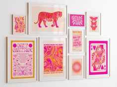 there are many framed pictures on the wall with pink and orange designs in them,