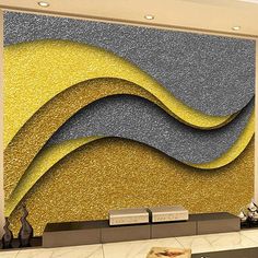 this is an image of a wall mural in a lobby with gold and silver colors