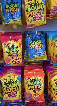 several bags of sour patch candy are on display