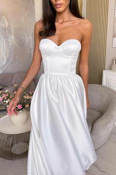 Bustier dress in midi length in White color. Allure your femininity by the dress design with deep neckline and pleats on the cups. The corset of bones and cups supports and emphasizes the chest. Lined. Satin Bustier, Bustier Dress, Deep Neckline, White Midi Dress, Dress Design, Skirt Length, Strapless Wedding Dress, Strapless Dress Formal, Midi Length