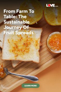 a wooden cutting board topped with bread and oranges