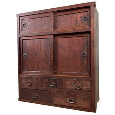 an old wooden cabinet with drawers and knobs on the doors is isolated against a white background