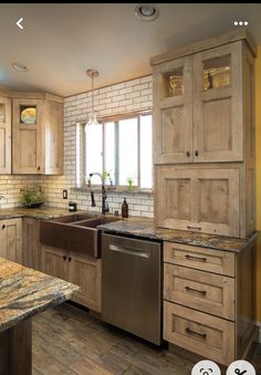 a kitchen with wooden cabinets and granite counter tops