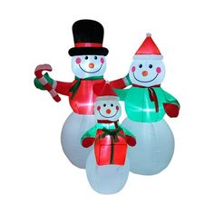 three inflatable snowmen with presents on them