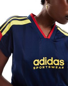 Tops by adidas performance Game-ready picks V-neck Short sleeves adidas branding Cropped length Regular fit Navy Sporty Top With Three Stripes, Navy Sporty Top With Contrast Stripes, Navy Sports Tops With Three Stripes, Navy Sports Top With Three Stripes, Sporty Adidas Logo Tops For Sports Events, Sporty Adidas Tops For Sports Events, Rodeo Chic, Adidas Branding, Cocktail Dress Formal