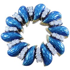 A classic piece by Tiffany & Company, this wreath brooch features 30 VVS quality full-cut diamonds, approximately 1.25 carat, accented by vivid blue enamel. The wreath is made in 18K white gold and signed Tiffany & Co Italy. Dimensions: 1.25 x 1.25 inch Royal Blue Jewelry, Tiffany And Co Jewelry, Fish Brooch, Tiffany Diamond, Gold Brooch, Tiffany Jewelry, Antique Brooches, Diamond Brooch, Gold Brooches