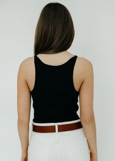 Introducing the Éterne Cropped Rib Tank in Black. Made from a lightweight 100% cotton rib fabric, this tank boasts a slim fit and thin tank straps. Its vintage-inspired neckline lends a touch of sophistication, perfect for pairing with jeans, leather pants, or as a layering piece under an oversized blazer or pantsuit. Available in Black 100% Cotton Designed for a slim fit Shop more women's designer tops here. ABOUT ÉTERNE Established in 2020, Eterne was founded by stylist Chloe Bartoli as the go-to destination for timeless and seasonless essentials. With a clear vision for the key items in a women’s wardrobe and how they should fit and function, the brand follows the guiding principles of high quality craftsmanship and wearable luxury. Chloe Bartoli, Guiding Principles, Fall Outerwear, Rib Fabric, Jumpsuit Jacket, Designer Tops, Clear Vision, Tops Online, Oversized Blazer