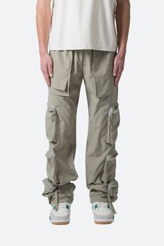 the Multi Pocket Drawcord Pants are designed with a relaxed fit throughout with cargo pockets throughout with zipper and snap closures, elastic waistband, and finishing off with elastic and cargo drawcords at the leg openings. details relaxed fit 100% cotton  model is 6’1, 160 lbs and wears a size M King Fashion, Carpenter Pants, Sherpa Pullover, Mohair Sweater, New Years Sales, Denim Flares, Green Jacket, Wool Jacket, Vintage Tees