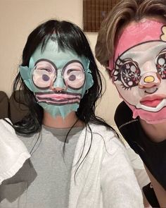 two girls with face paint on their faces