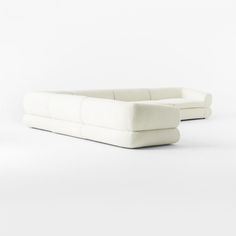 two white couches sitting next to each other on top of a white flooring