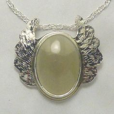 Mother of Pearl Sterling Silver Angel Wings Pendant with 20 inch Sterling Double Rope Chain by SmithSilver MOP cabochon is 13 x 18mm.  Pendant is 1 inch x 1 inch. Mother of Pearl is produced by some mollusks as an inner shell layer; it also makes up the outer coating of pearls. It is strong, resilient, and iridescent. It is said to attract prosperity. Live long and prosper! Sterling Silver 1.4mm double rope chain is 20 inches long and made in the USA. Last photo shows the back side and my SmithSilver stamp of authenticity. USPS FIRST CLASS Package rate includes tracking & insurance for your assurance. Your ONE-OF-A-KIND Pendant/Necklace will arrive in a Silver Foil Gift Box SEE ALL MY PENDANTS AND NECKLACES AT: https://www.etsy.com/shop/SmithSilver925?ref=seller-platform-mcnav§ion_id=19389 Silver Cabochon Jewelry For Memorial, Collectible Silver Oval Cabochon Jewelry, Silver Jewelry With Large Oval Cabochon Pendant, Silver Oval Cabochon Necklace For Anniversary, Angel Wings Pendant, Live Long And Prosper, Wings Pendant, Silver Angel Wings, Lubbock Tx