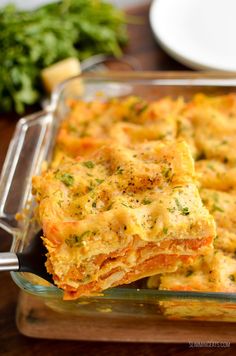 a casserole dish with cheese and vegetables in it