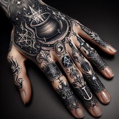 a person's hand with tattoos on it