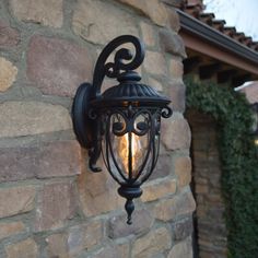 an outdoor light on the side of a building