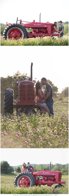 two people are kissing in the middle of a field next to a red farm tractor