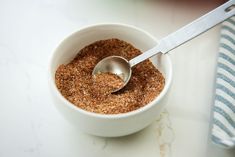 a bowl filled with brown sugar and a spoon