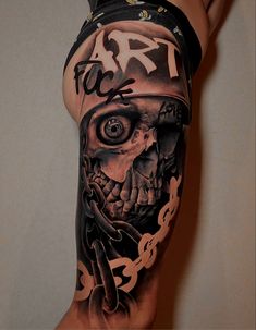 a man's leg with a tattoo on it and a skull in the middle