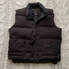 Canada Goose Vintage Men's Down Vest, Size L, Black Color, Six External Pockets,Excellent Vintage Condition, No Holes. Has The Early Generation Logo. Check The Original Labels Inside. Measurements: Neck Seam To Hem: 26" Pit To Pit: 24" The Front Is Shorter. Mens Down Vest, Down Vest, Canada Goose, Vintage Men, Black Color, Mens Jackets, Jackets & Coats, Man Shop, Black