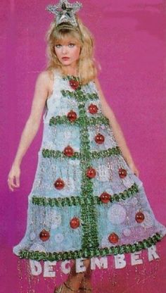 a woman in a dress made out of buttons and beads with the words december written on it