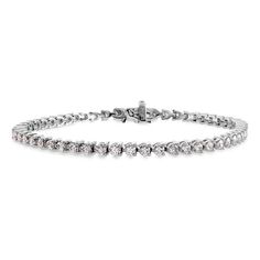 This item is crafted from 18k white gold and features a diamond gemstone with a color grade of I-J. It is part of the Temptation collection. Fire Jewelry, Hearts On Fire, Jewelry Showcases, Diamond Tennis Bracelet, White Gold Bracelet, Fire Heart, Tennis Bracelet Diamond, Diamond Bracelets, Brilliant Diamond