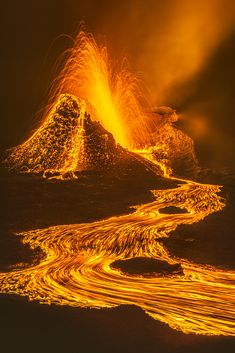 an image of a volcano that looks like it has lava coming out of the ground