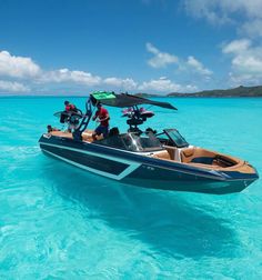 a boat with two people on it in the water