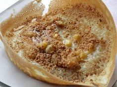 a piece of bread that has some kind of topping on it, sitting on a plate