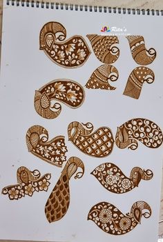 an image of hens and paisley designs on a sheet of paper with marker pens