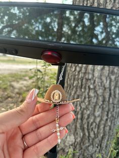 Brown hat with rhinestone trim and Virgin Mary Charm. Gem cross charm  3 inch hat.  Charms comes ready to hang Cross Car Charm, Western Diys, Western Car, Cool Car Accessories, Brown Hat, Rear View Mirror Decor, Cute Car Accessories, Jewelry Accessories Ideas, Dope Jewelry