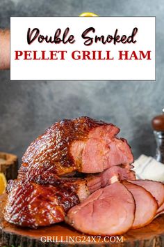 a large piece of meat sitting on top of a wooden cutting board with the words double smoked pellet grill ham